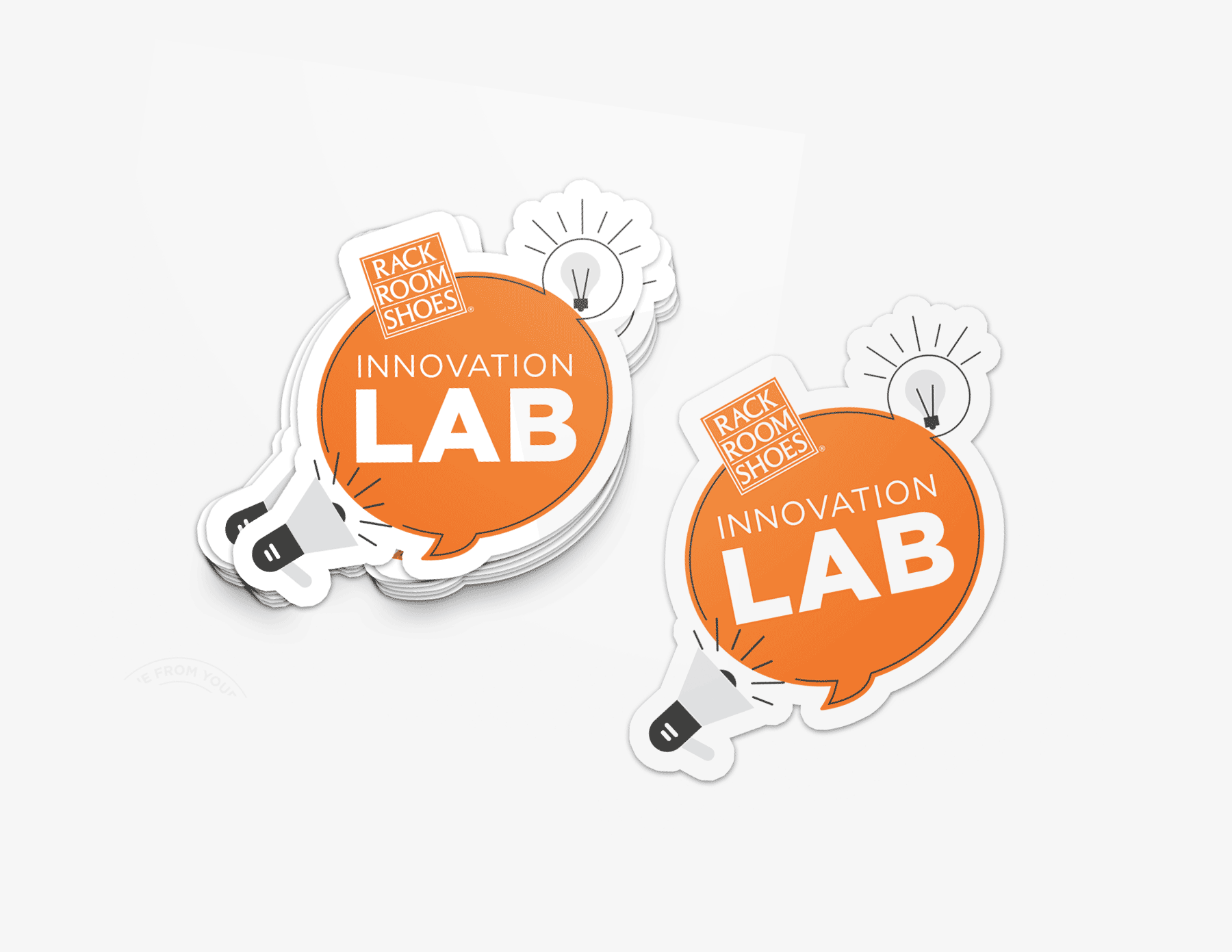 a stack of stickers with the innovation lab logo on them