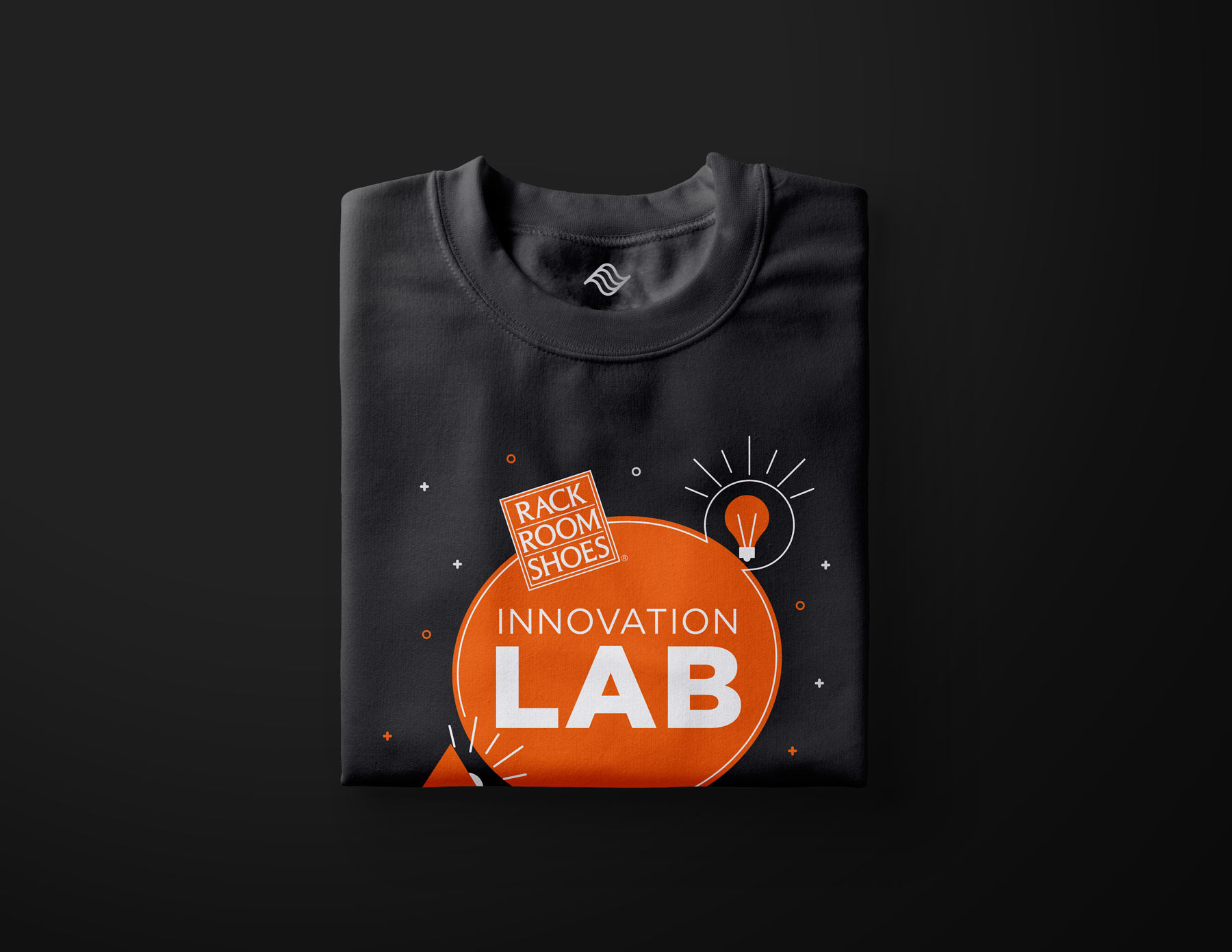 black t-shirt with the innovation lab logo on it posted on a black background